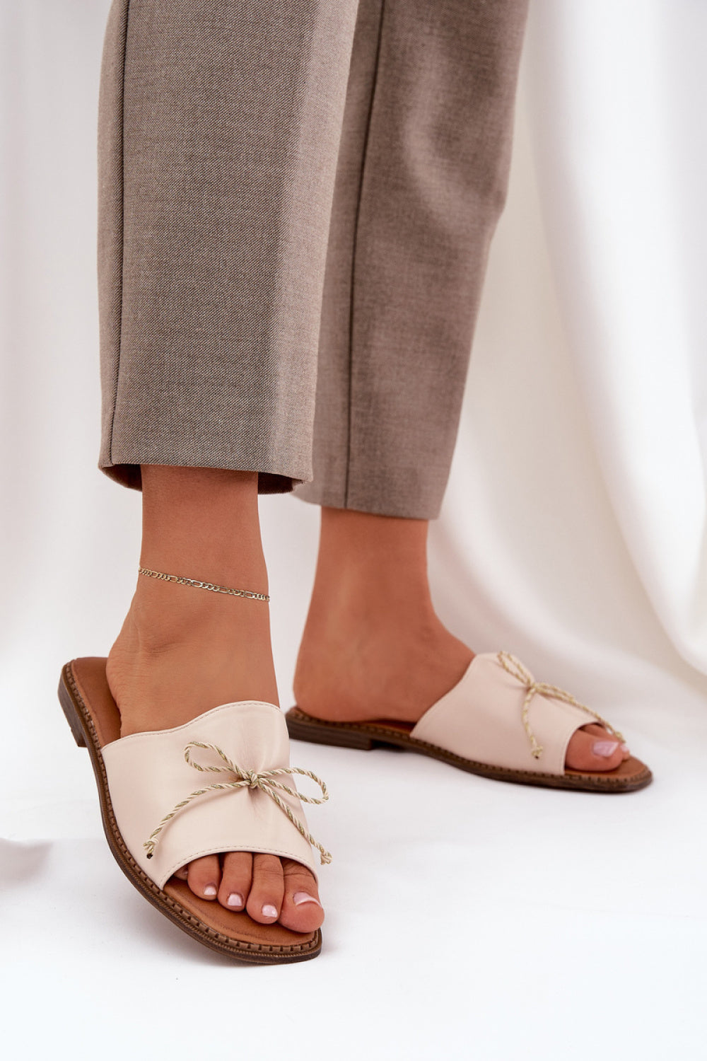 Step In Style Deonelis Beige Faux Leather Flat Flip Flops with Bows