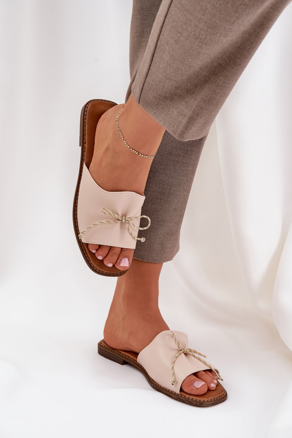Step In Style Deonelis Beige Faux Leather Flat Flip Flops with Bows - view 3